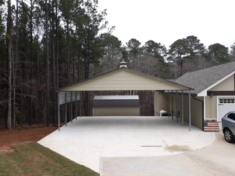 A Classic tan with Burgundy cupola on the roof. carport is installed next to a garage on a concrete pad.