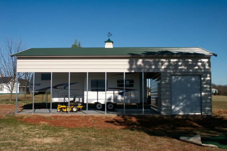 Big open carport with green roof. Sheltering an RV